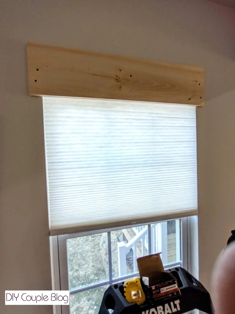 first board attached on top of window