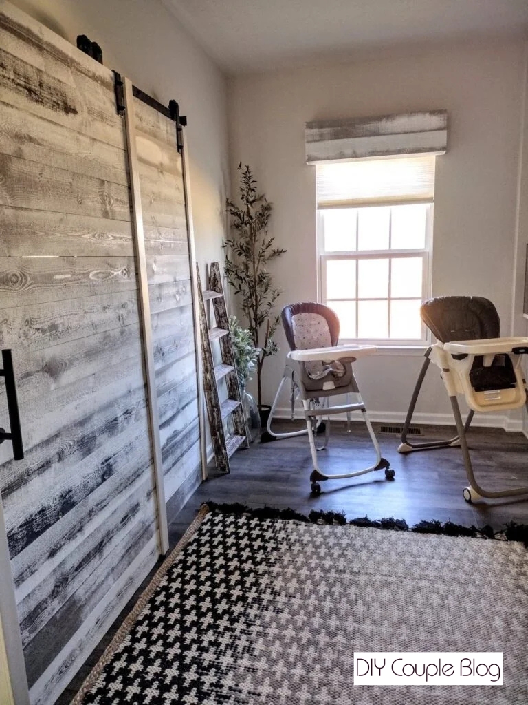 farmhouse kitchen with matching wood window cornice and barn door in rustic wood
