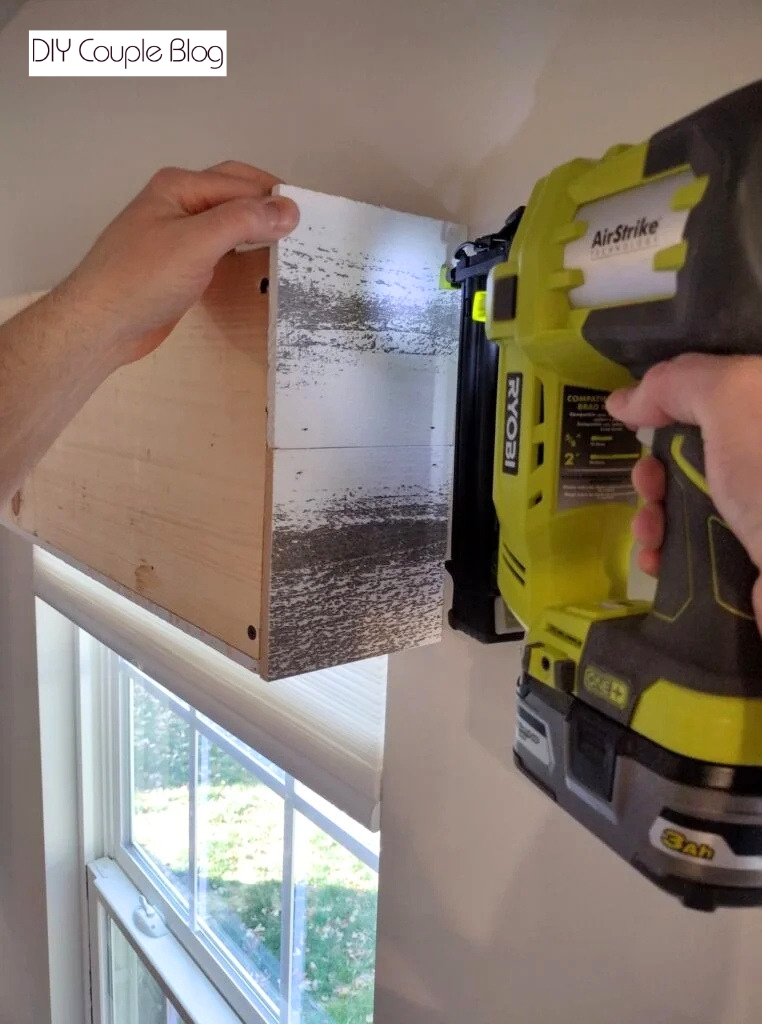continuing to attach the wood planks to the wood frame