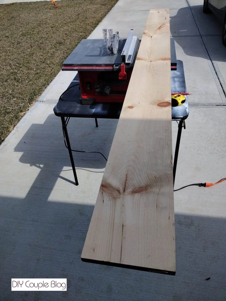 wood board sitting on table saw