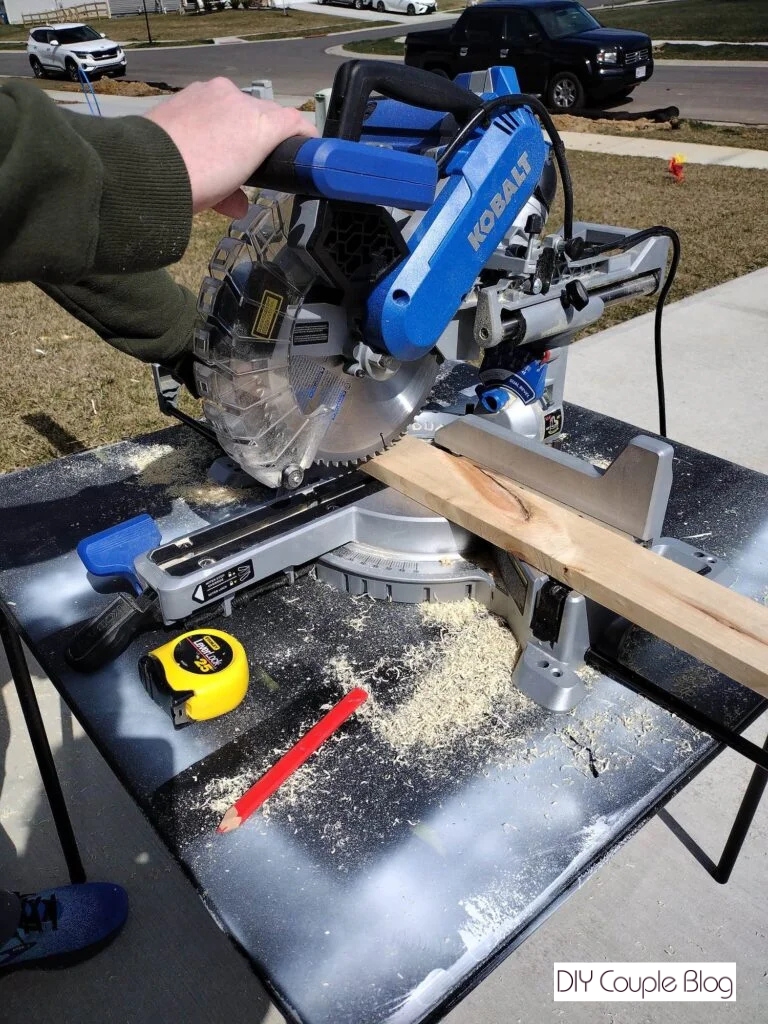 making a cut using a miter saw