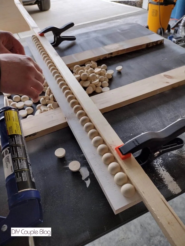 adding flat back farmhouse beads to wood board