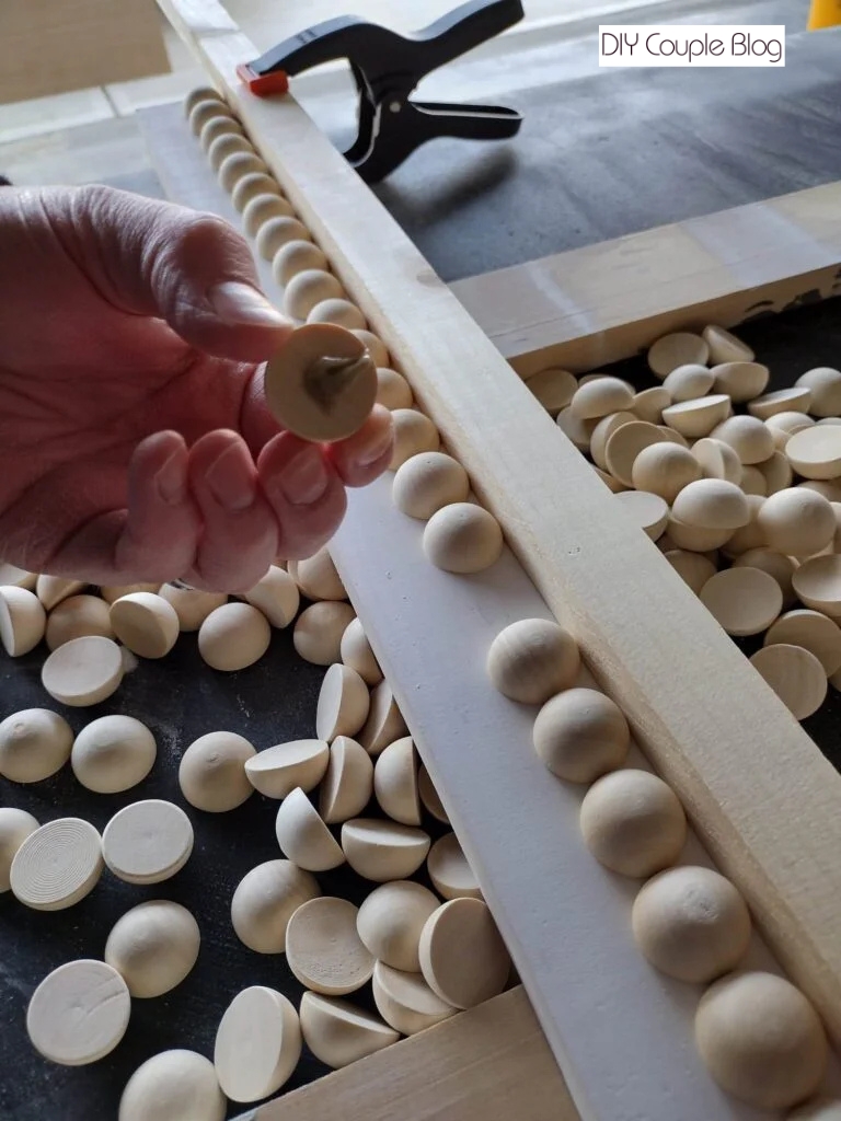 adding a dot of glue to the back of beads