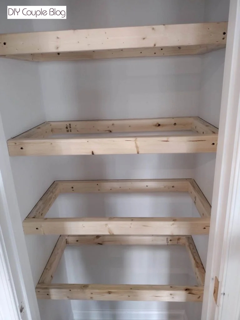 all four shelf frames secured to the wall