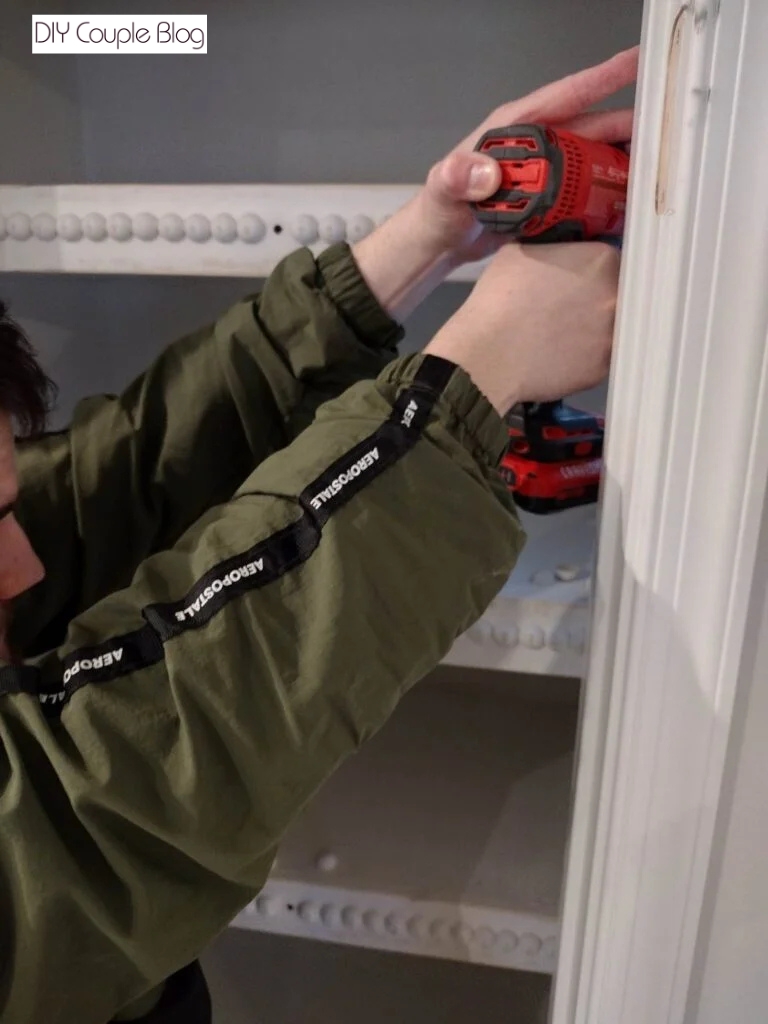 installing the right side of DIY pantry shelves