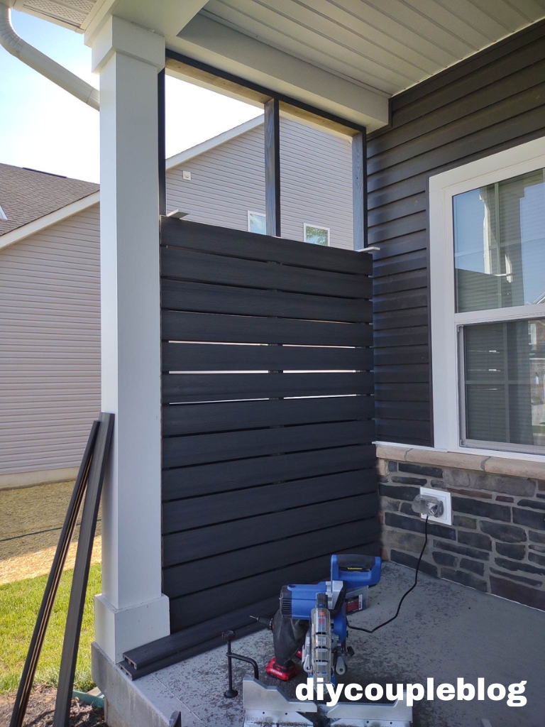Close-up of wooden privacy wall panels being assembled