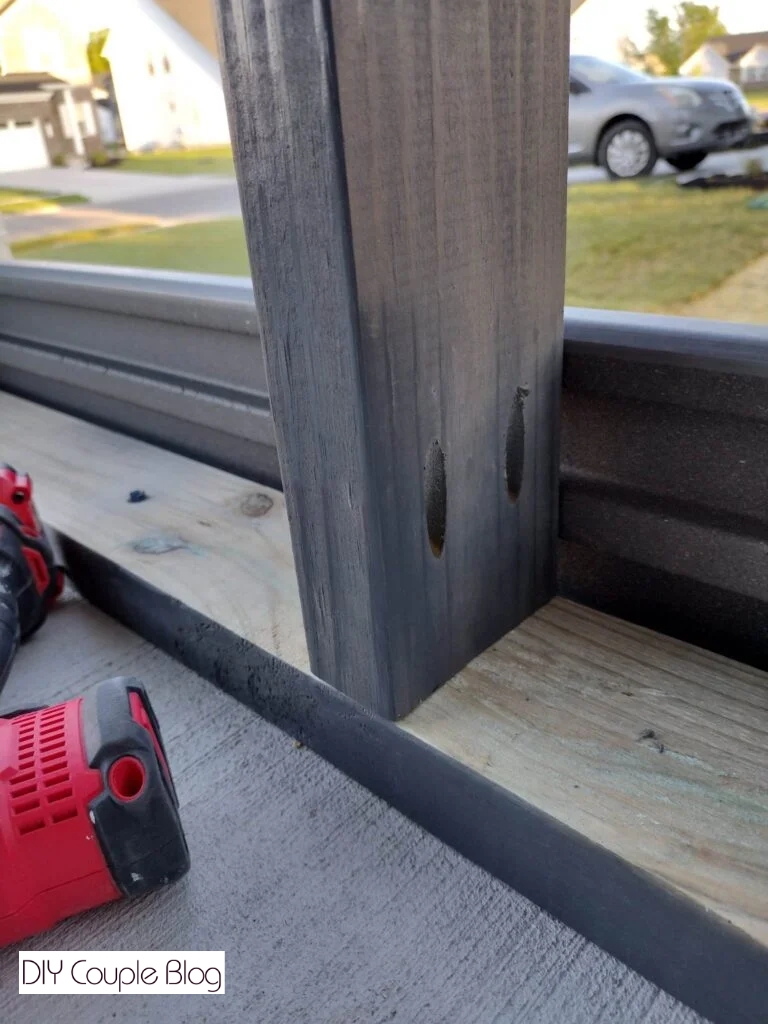 attached middle board then securing composite decking boards to the back