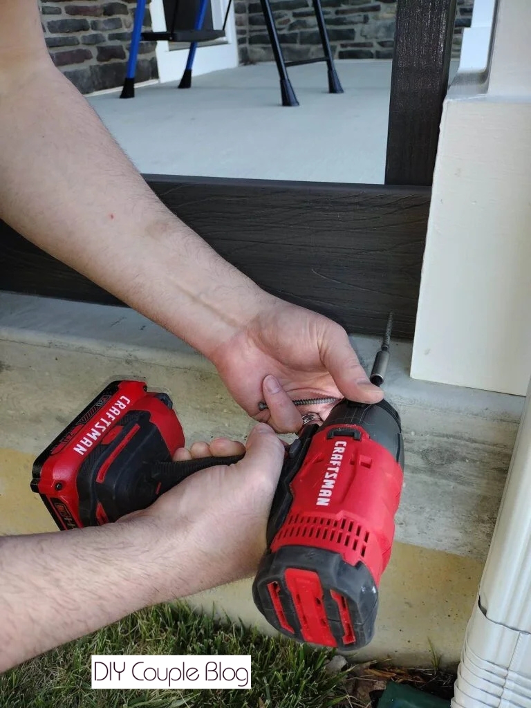 installing composite boards to privacy wall