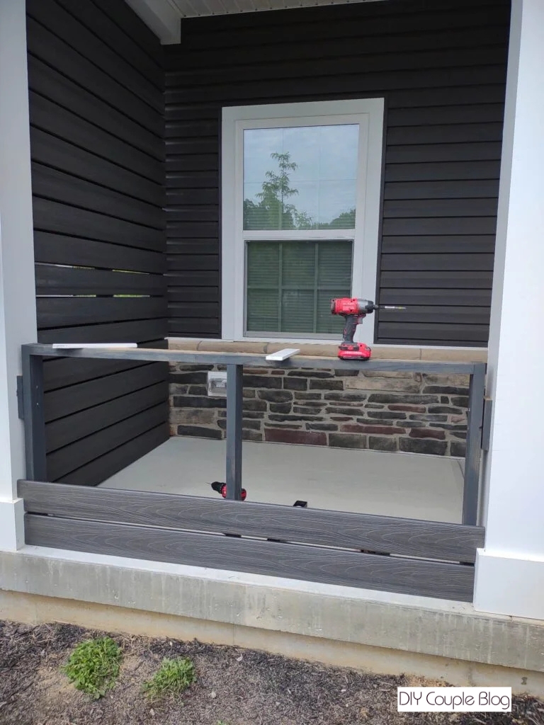 securing the second composite deck board to the wood frame 