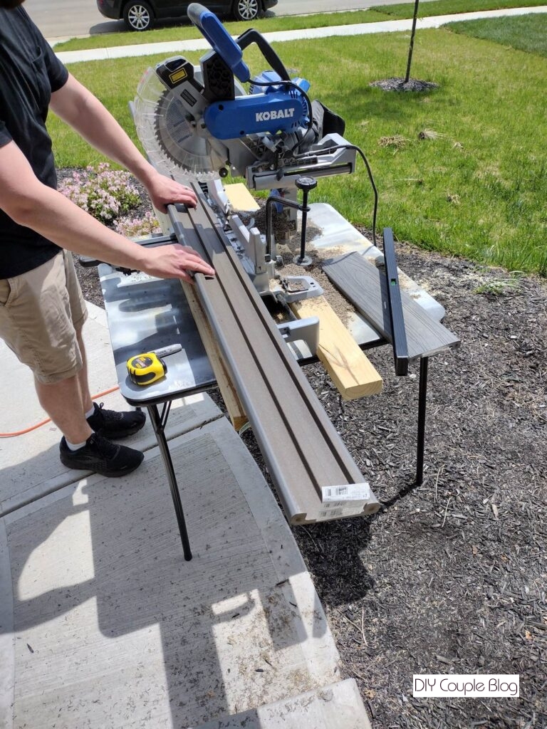 cutting the composite decking boards to make the front porch railing 