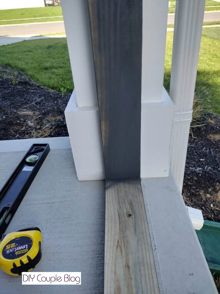 showing the frame anchored to the concrete and against the column