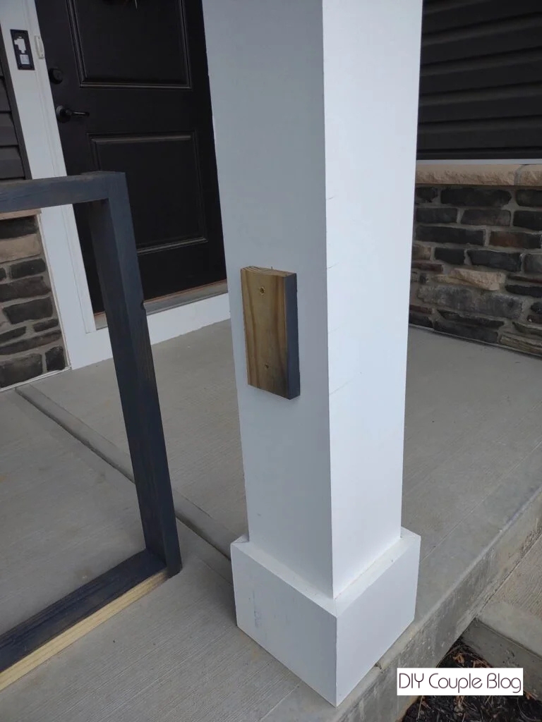 attaching the wood frame to the front porch post columns 