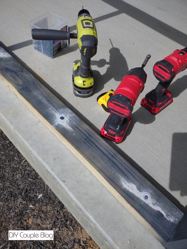 close-up of frame anchored to the concrete porch