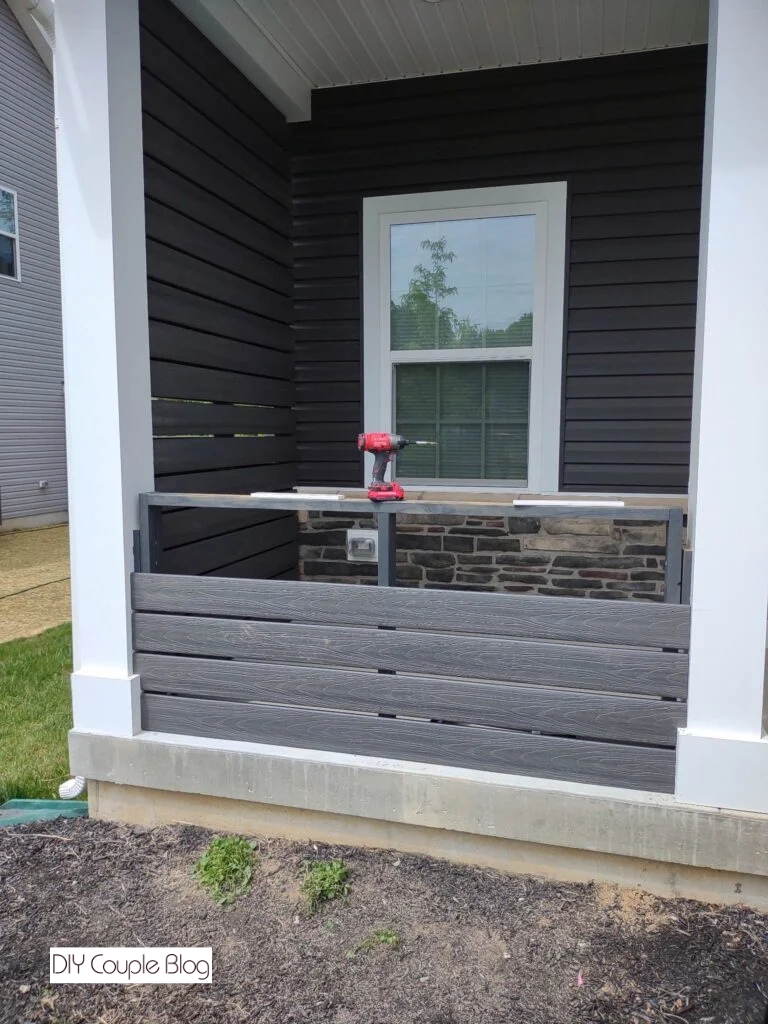 continuing to add the composite decking boards 