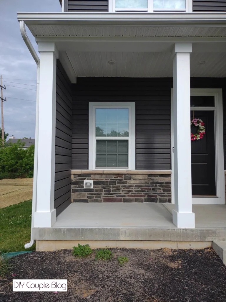 close-up before photo of front porch before adding a modern railing to match privacy wall