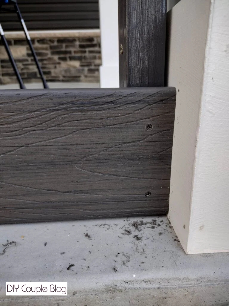 securing the board to the frame with two composite decking screws