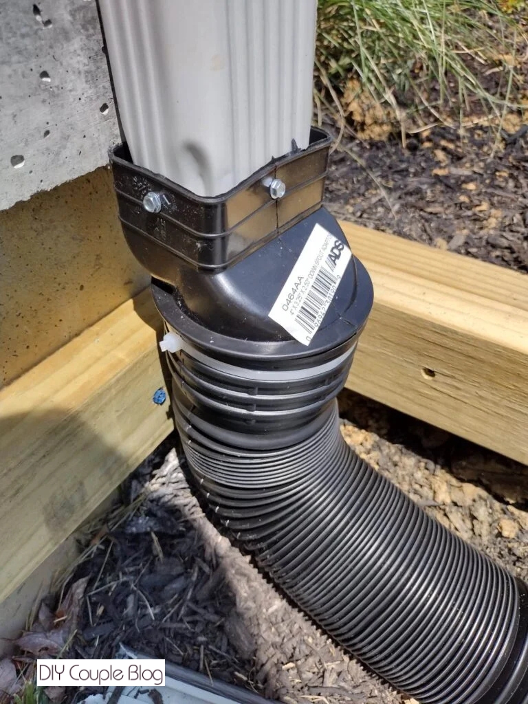 extending gutter downspout with an adapter and flexible drain hose