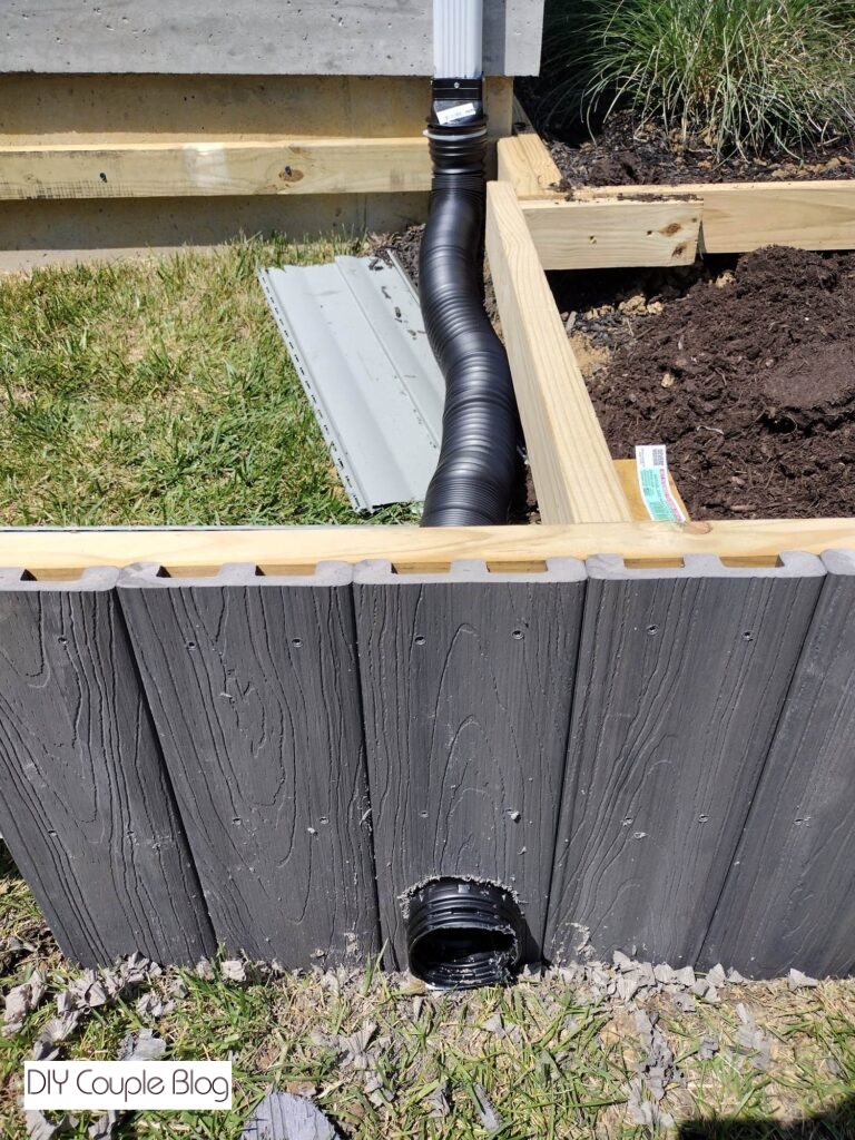 gutter downspout extension existing through landscaping