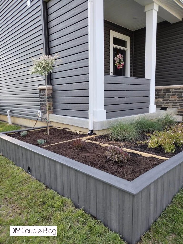 finalizing landscaping with extending the gutter downspout throughout