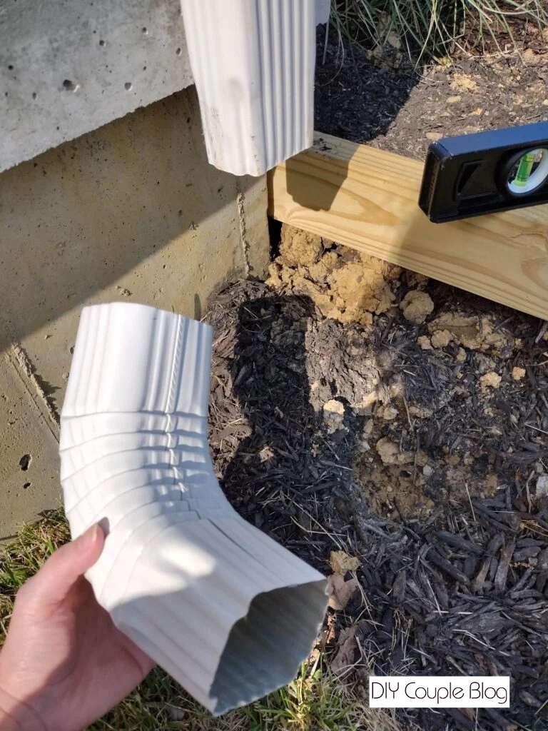removing bottom part of gutter to extend gutter downspout