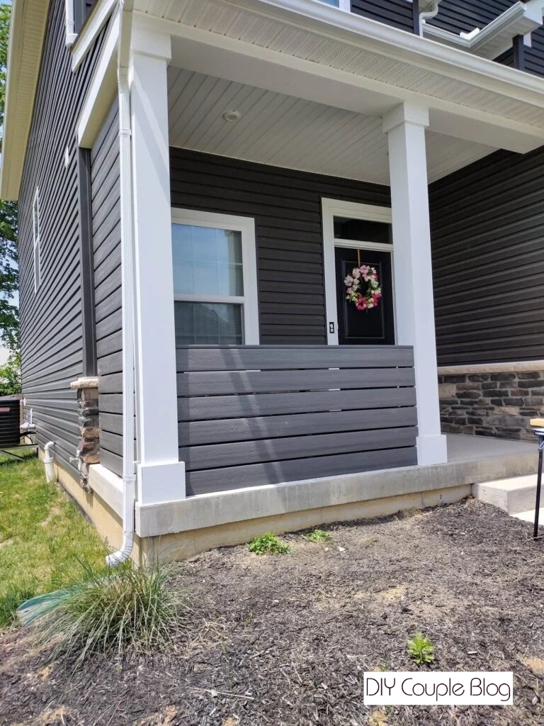 gutter downspout in the way of a raised flower bed design going to wrap around the house