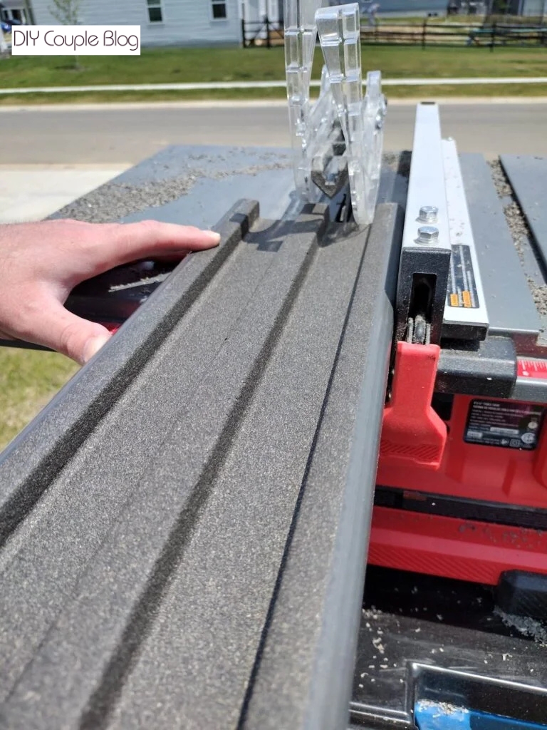 ripping the composite decking board with table saw for a precise fit