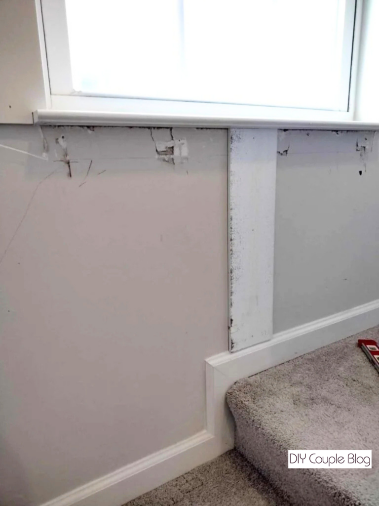 first wood board installed at the bottom of the wall