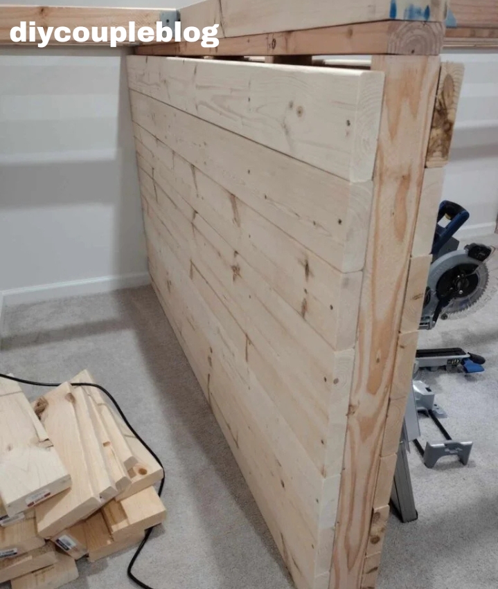 attaching wood boards to the outside support walls