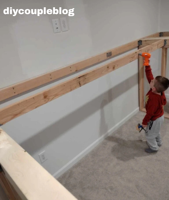 kid using pretend drill to help with DIY project 