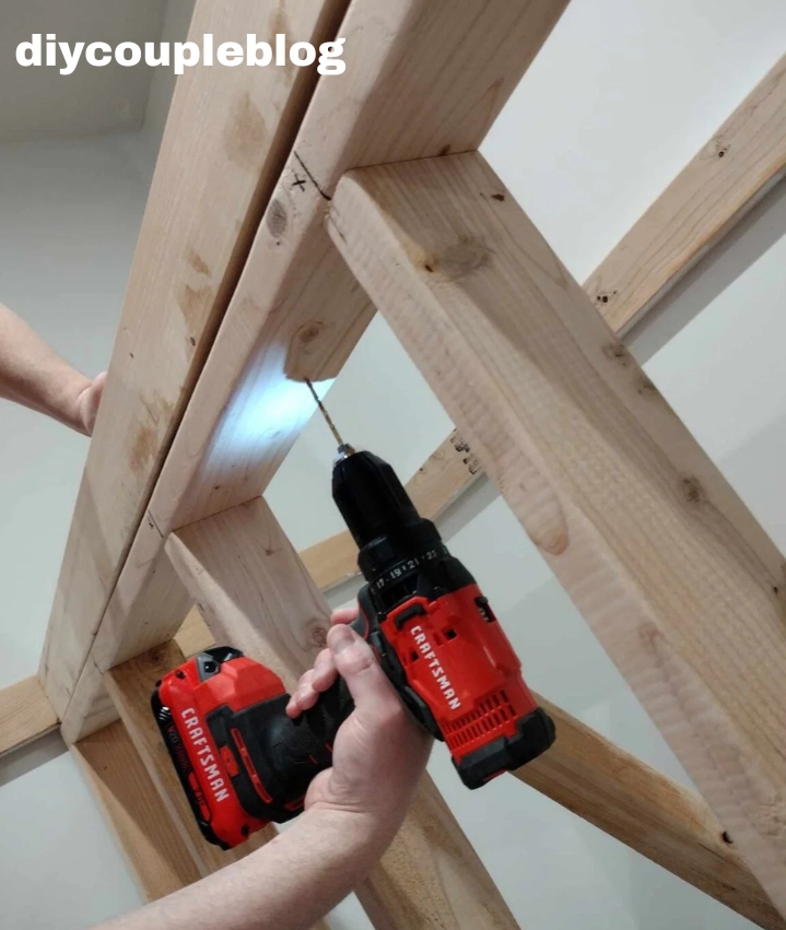 drilling pilot holes for attaching the wood board 