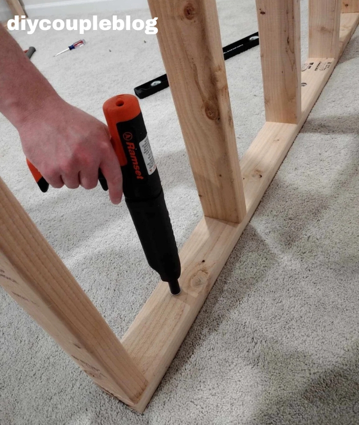 attaching the base of the playground through concrete basement floor.