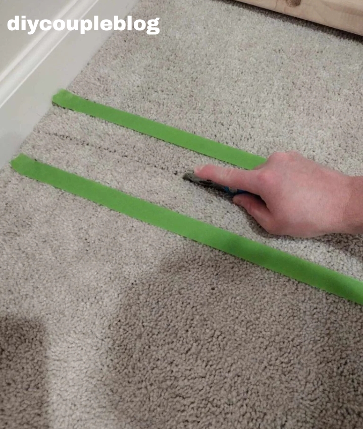 cutting through the carpet with a razor knife
