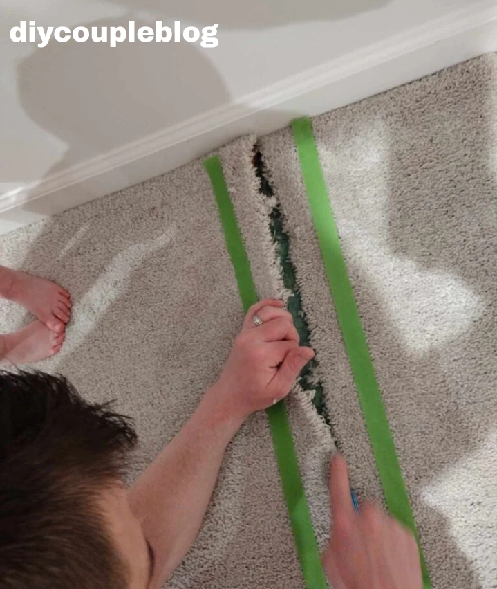 pulling carpet apart with hands