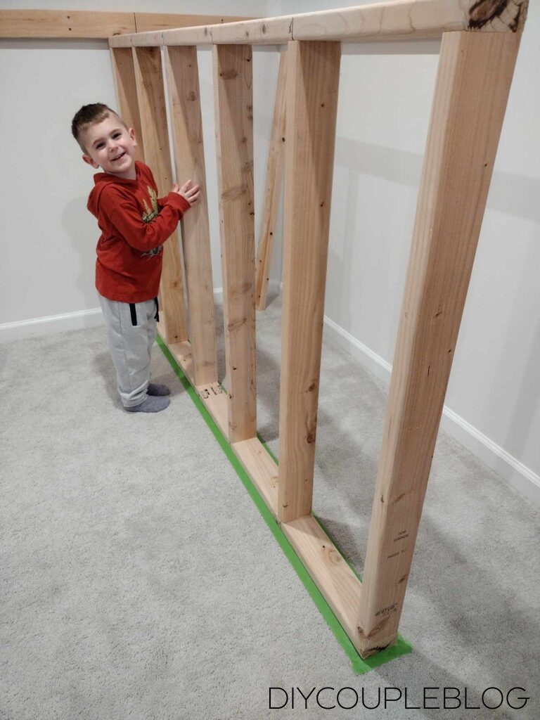 kid helping with the building project of the new playground
