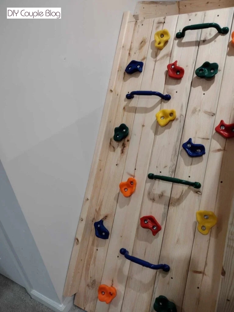 adding a board between the wall and rock wall 