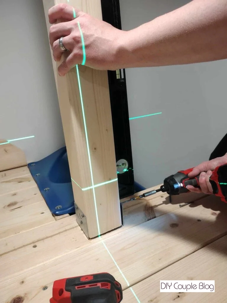 leveling the posts and securing them 