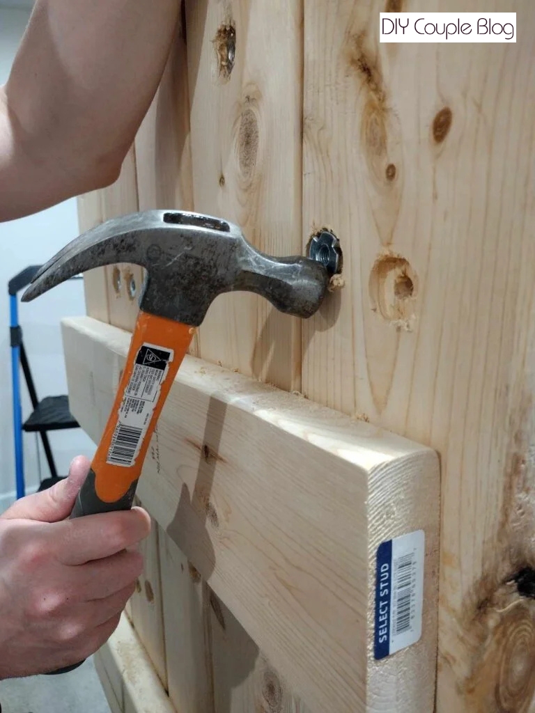 smacking the back with a hammer 