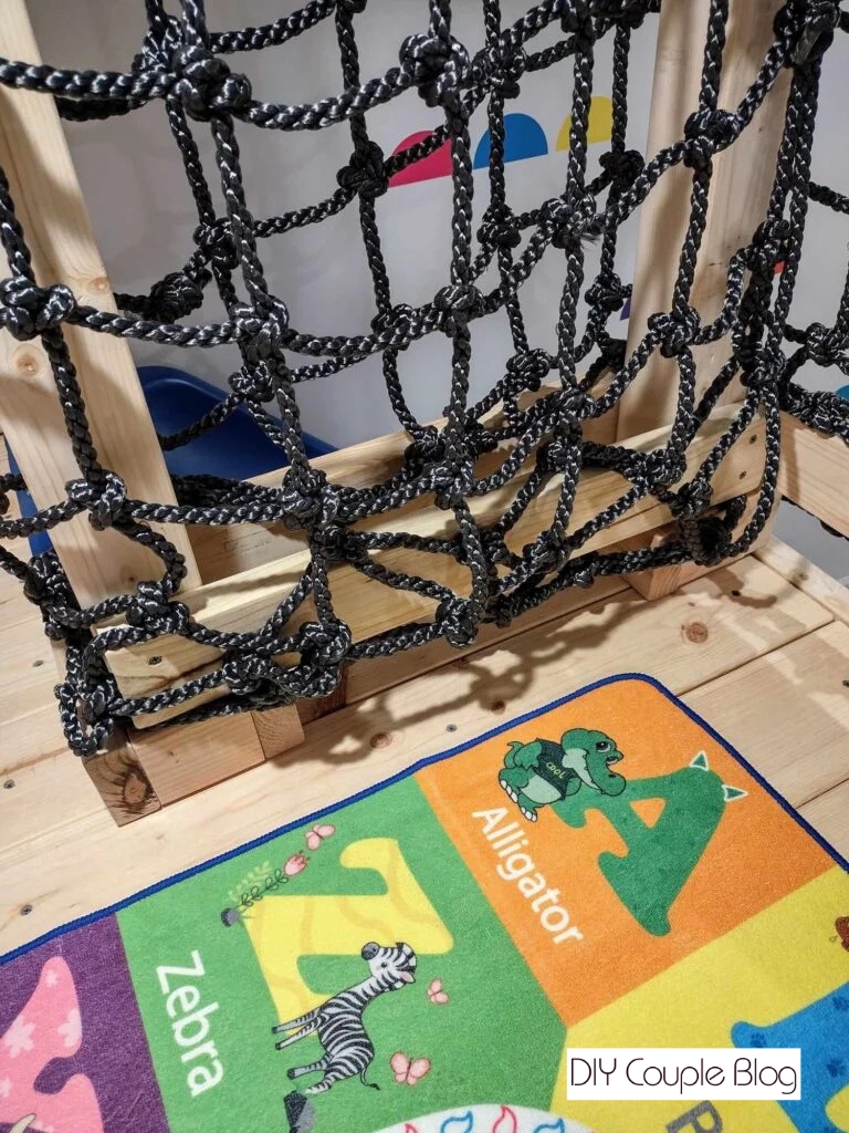 cargo net railing DIY to complete a wood jungle gym 