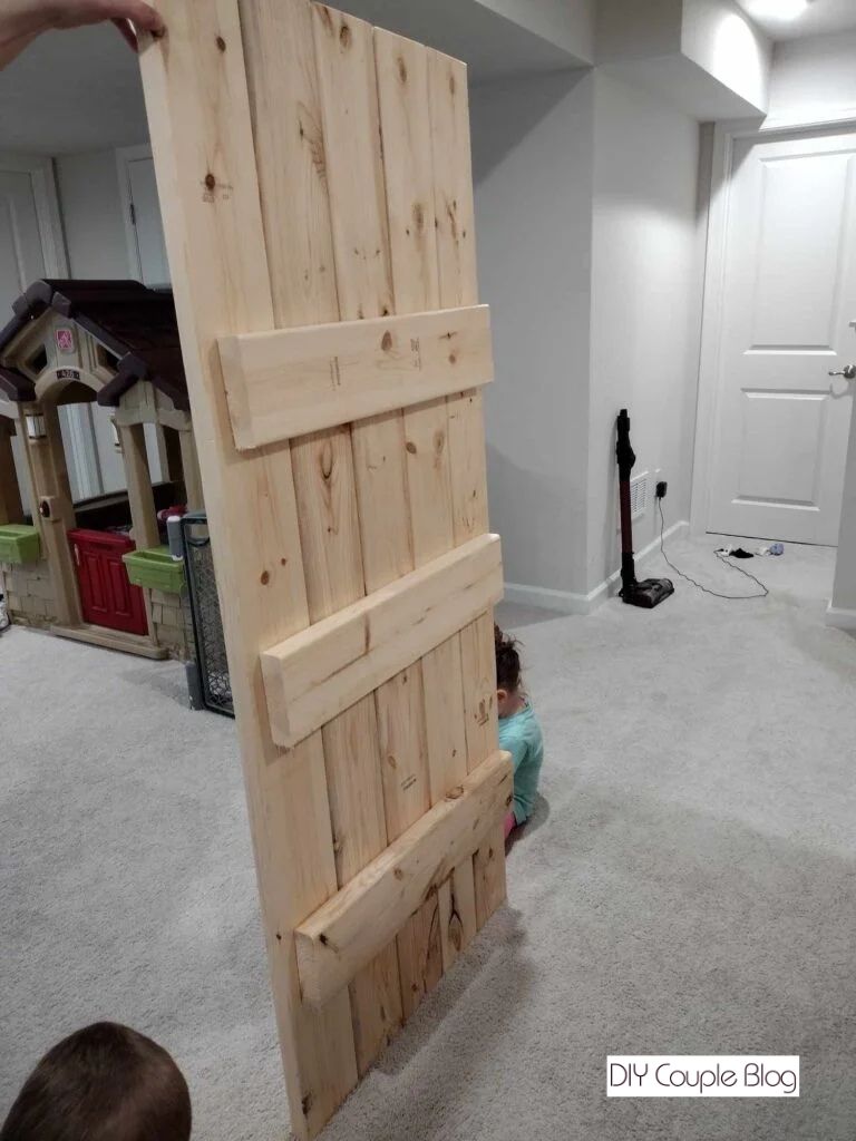 standing wood up to see the back side 
