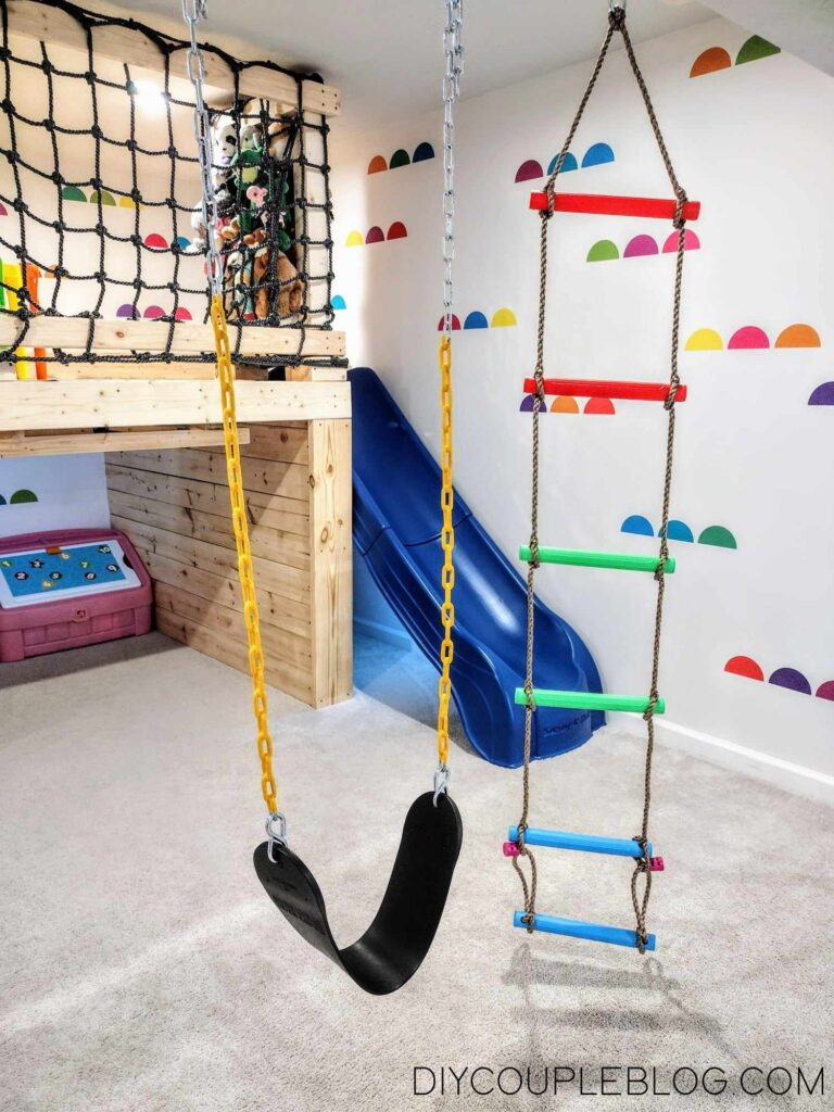 ideas for playrooms for toddlers with a swinging climbing ladder and a playground swing