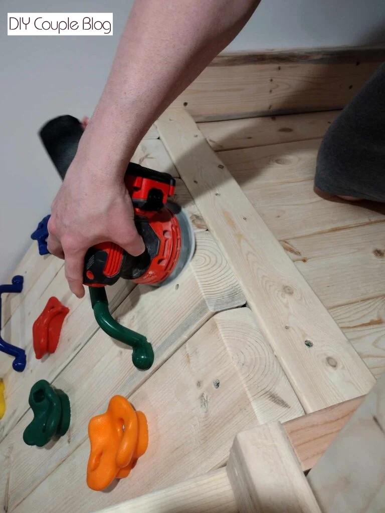 process of finishing up diy climbing wall for kids 
