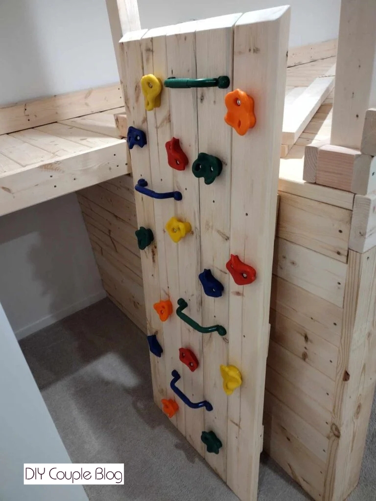 building a rock wall attached to our indoor jungle gym 