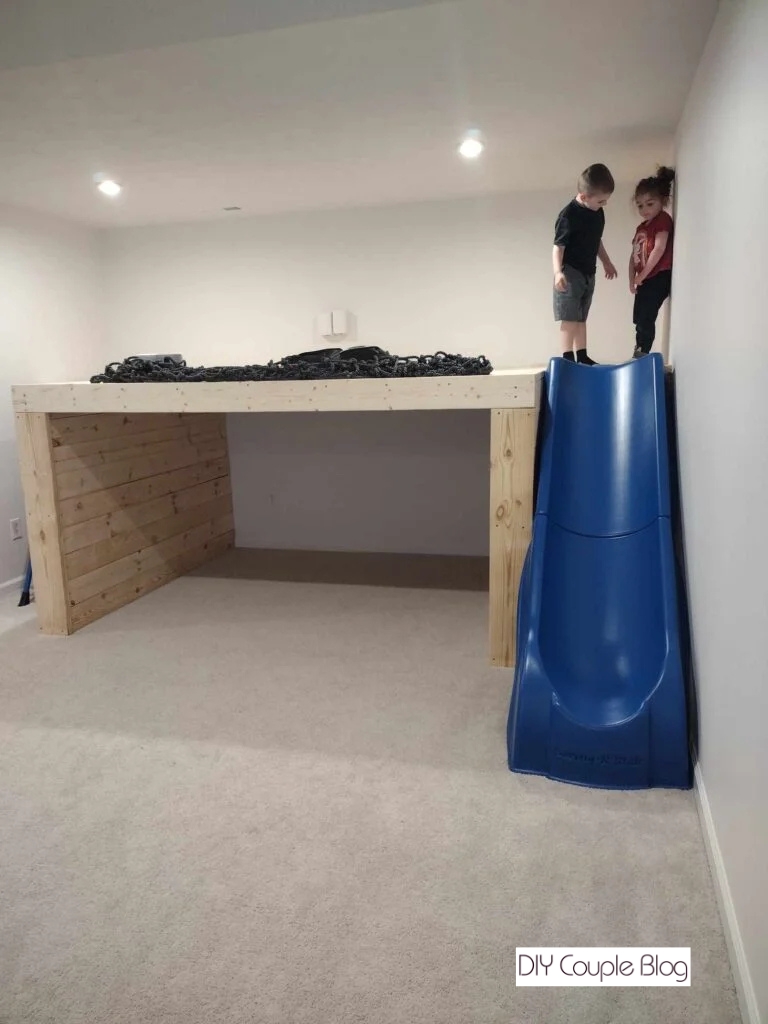 kids standing on wood playground platform