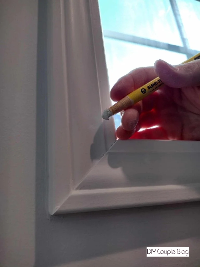 showcasing the results on the window using a product that fills the holes