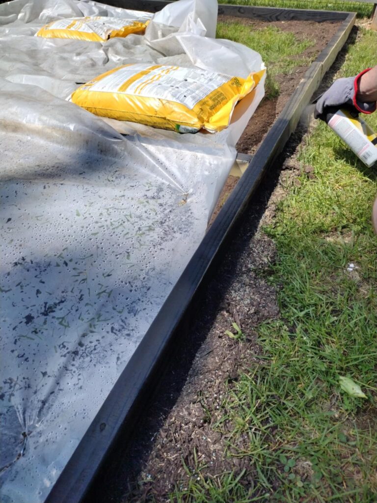 last minute spray paint for the 2x 4 boards around the playground