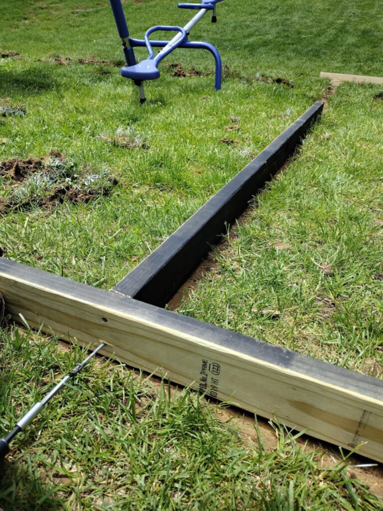 two connecting 2x4 boards for a diy backyard playground