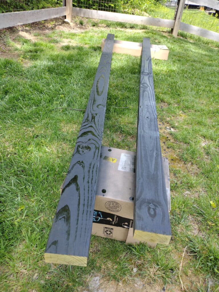 painted wood boards before installing playground border