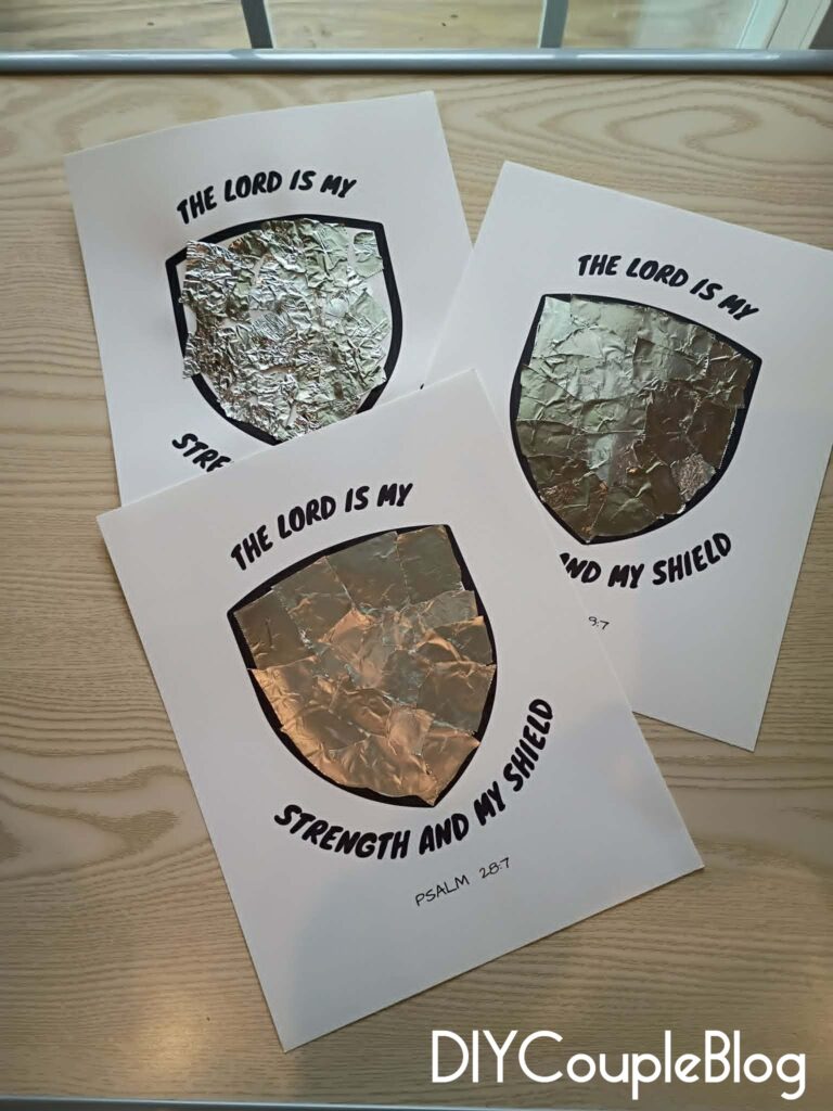 torn aluminum foil to make the metal look of a shield of faith