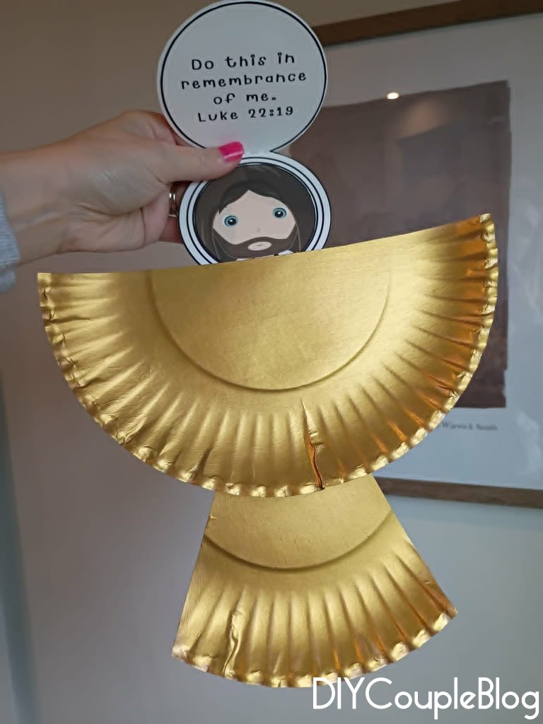 attaching the body of Christ to the gold chalice 