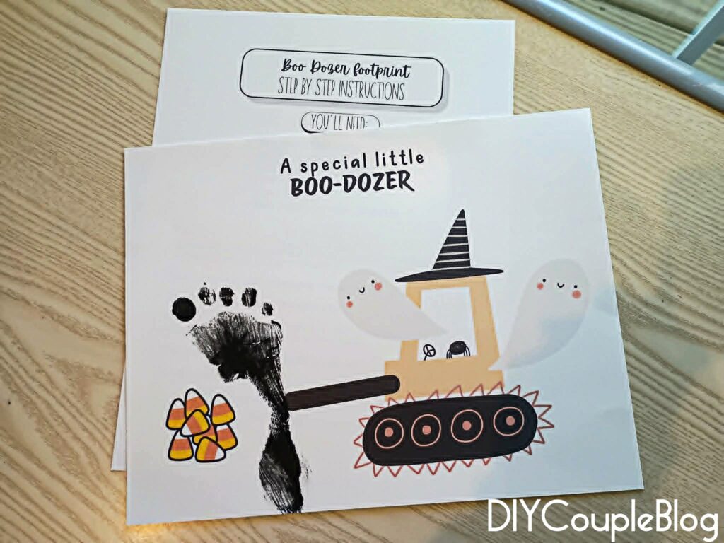 spooky halloween footprint art with bulldozer "boo-dozer" and the footprint as the blade scooping candy corn